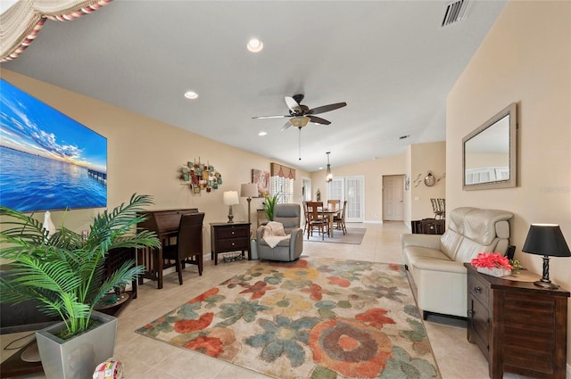 tiled living room featuring ceiling fan and lofted ceiling