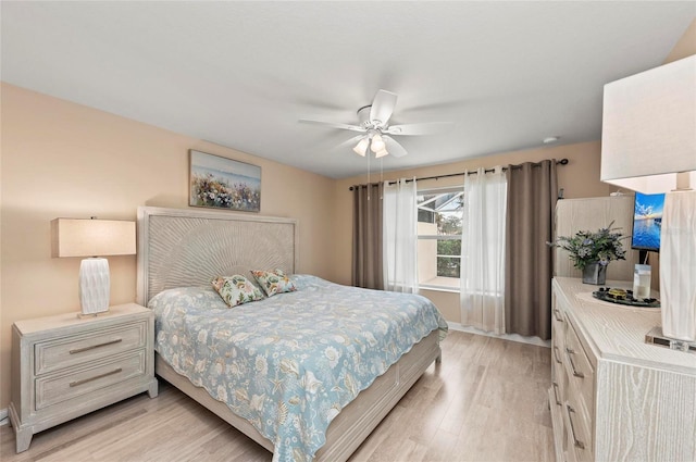 bedroom featuring ceiling fan and light wood-type flooring