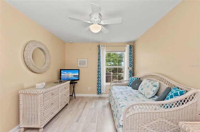 bedroom with light hardwood / wood-style flooring and ceiling fan