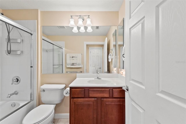 full bathroom featuring vanity, bath / shower combo with glass door, and toilet