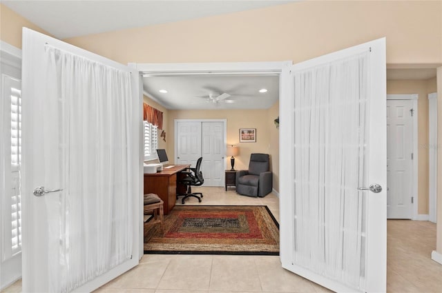 office space featuring light tile patterned floors, vaulted ceiling, and ceiling fan