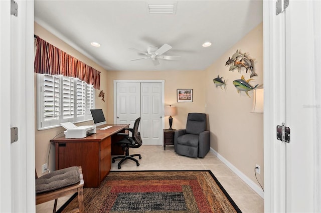 tiled office featuring ceiling fan