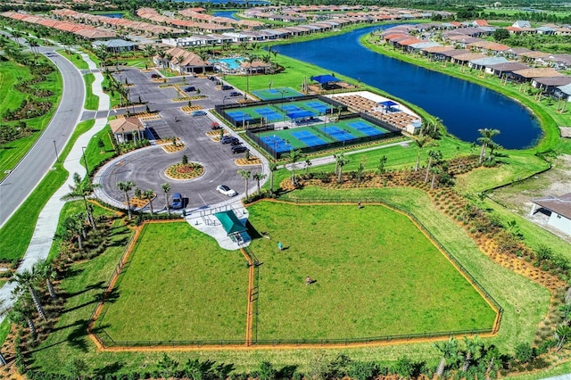 birds eye view of property with a water view