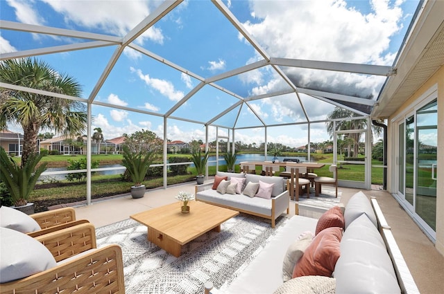 sunroom / solarium with a water view