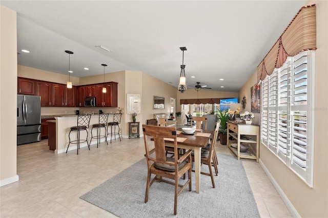 dining room with light tile patterned flooring and ceiling fan