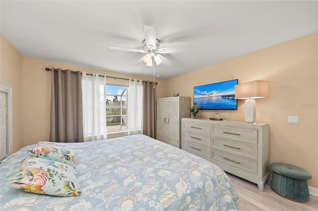 bedroom with light hardwood / wood-style floors and ceiling fan