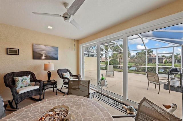 entryway featuring a textured ceiling and ceiling fan