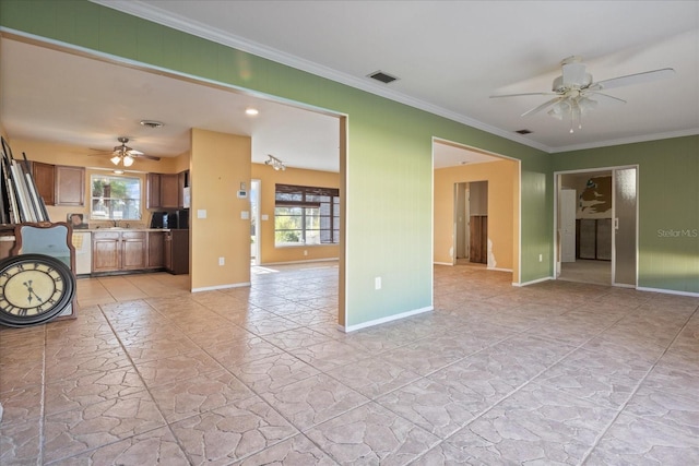 unfurnished living room with crown molding, sink, and ceiling fan