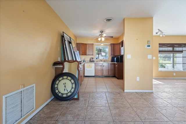 kitchen featuring dishwasher, plenty of natural light, sink, and ceiling fan