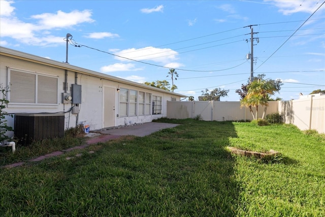 view of yard with central AC