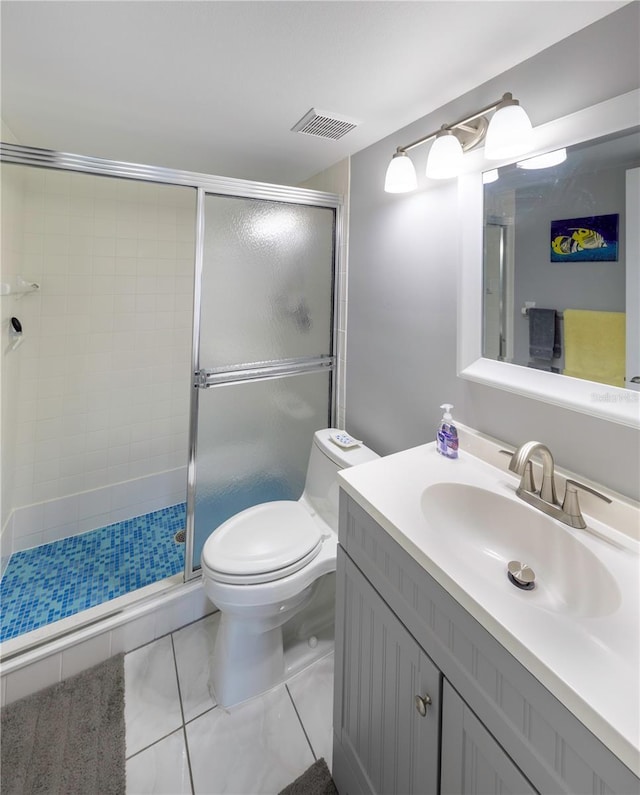 bathroom with toilet, a stall shower, visible vents, and vanity