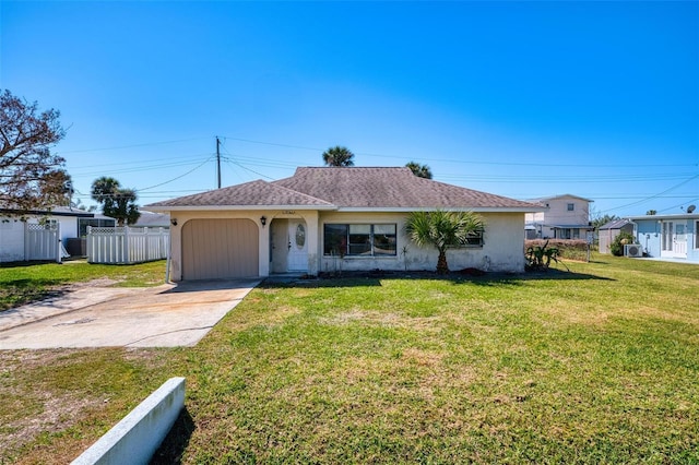 single story home featuring a garage and a front yard