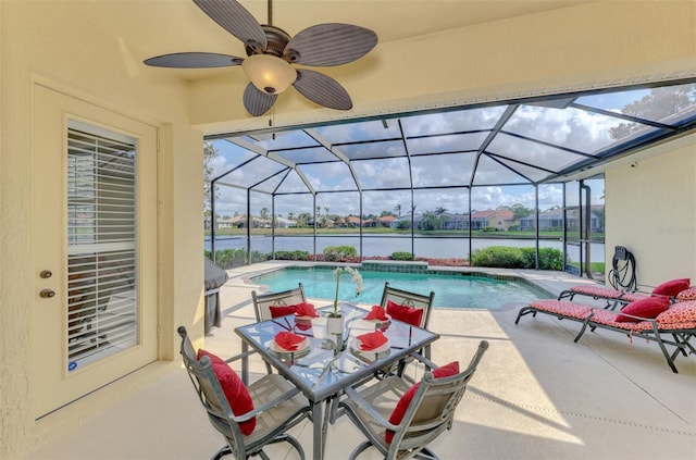 view of pool featuring glass enclosure and a patio area