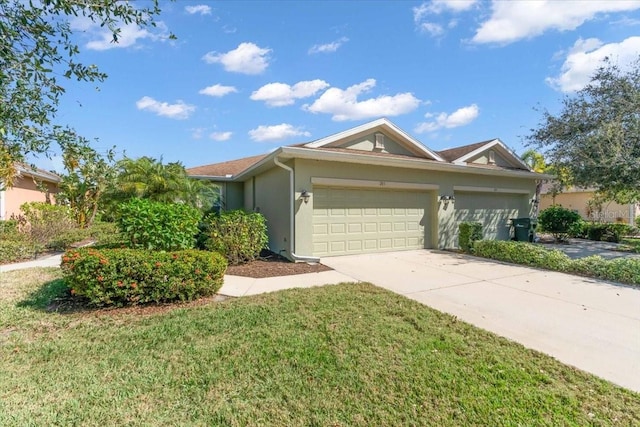 ranch-style home with a garage and a front lawn