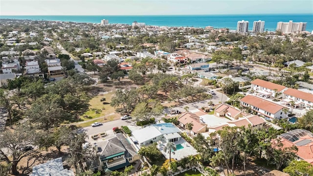 drone / aerial view with a residential view and a water view