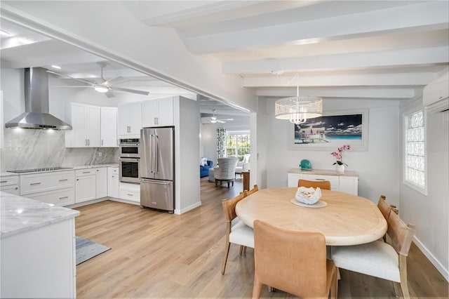 dining space with light wood-style floors, beam ceiling, baseboards, and ceiling fan with notable chandelier