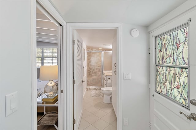 bathroom featuring toilet and tile patterned floors
