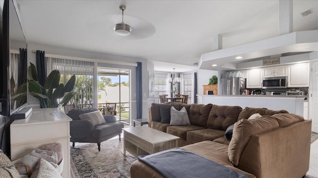 living room with a notable chandelier