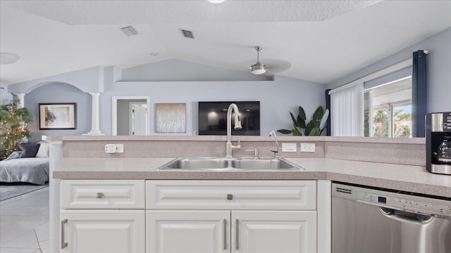 kitchen featuring white cabinetry, dishwasher, sink, and decorative columns