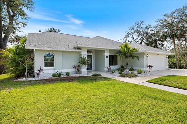 single story home featuring stucco siding, concrete driveway, a garage, and a front yard