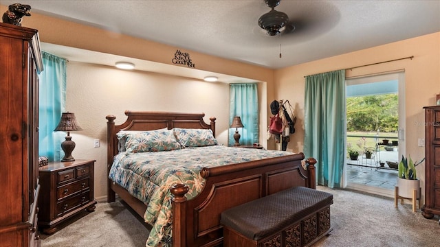 bedroom featuring access to outside, light colored carpet, and ceiling fan