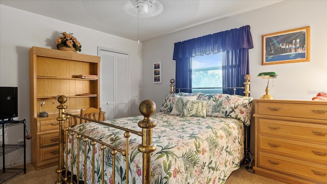 bedroom with light carpet and a closet