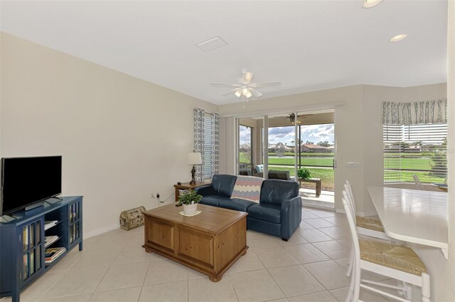 tiled living room with ceiling fan