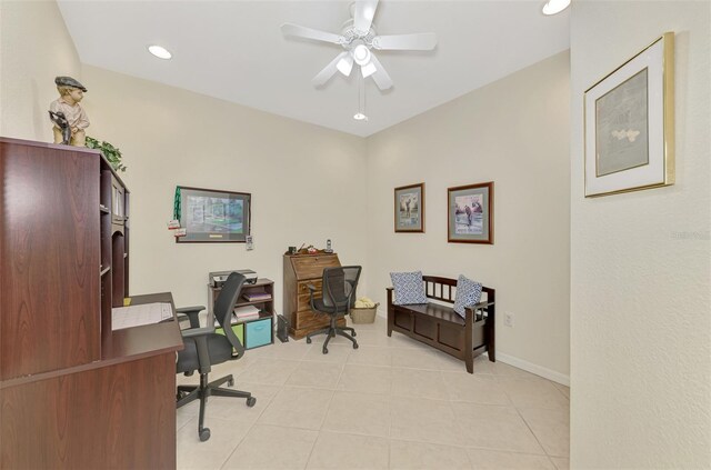 tiled home office featuring ceiling fan