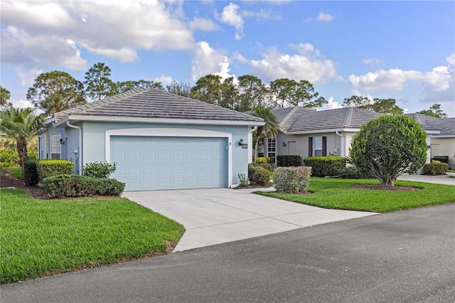 ranch-style house featuring stucco siding, concrete driveway, a front yard, a garage, and a tiled roof