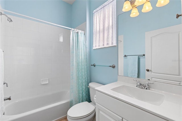 bathroom with toilet, shower / tub combo, and vanity