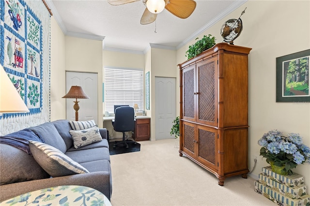 office area featuring light carpet, ceiling fan, and crown molding