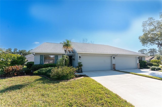 single story home with a garage and a front yard