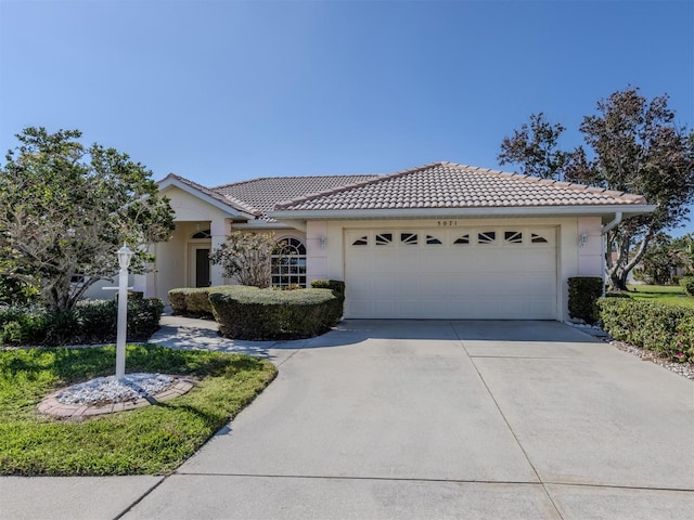 ranch-style home with a garage