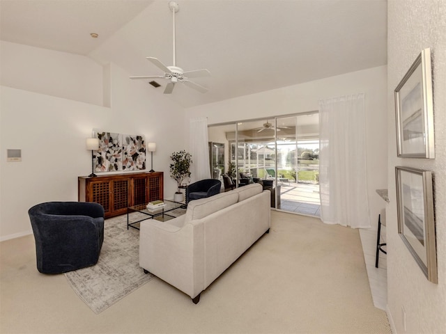 carpeted living room with vaulted ceiling and ceiling fan