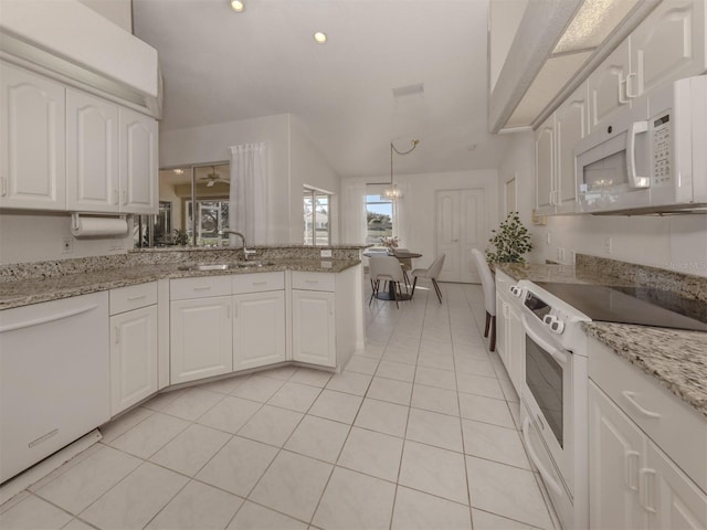 kitchen featuring white cabinetry, white appliances, decorative light fixtures, and light stone counters