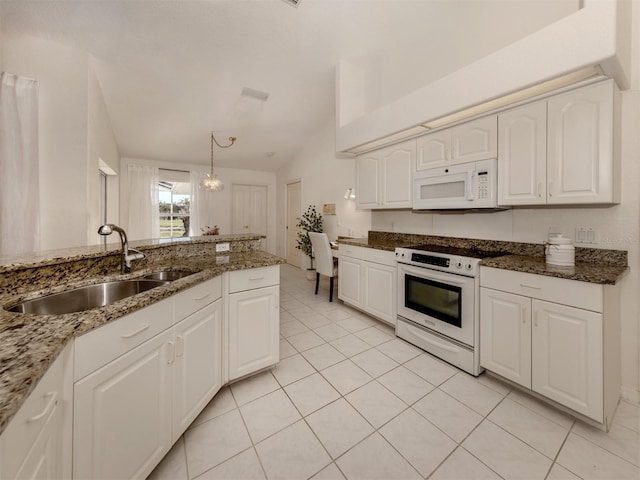 kitchen with sink, white cabinetry, decorative light fixtures, dark stone countertops, and white appliances