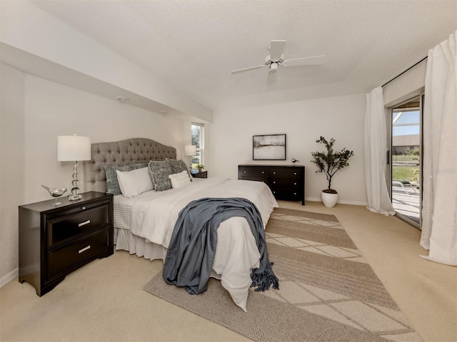 carpeted bedroom featuring ceiling fan, a textured ceiling, and access to outside