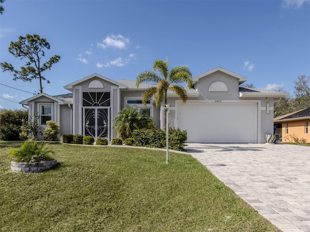 view of front facade featuring an attached garage, a front lawn, decorative driveway, and stucco siding