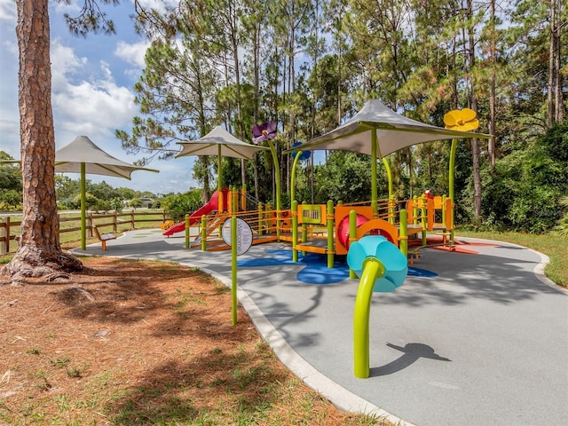 communal playground featuring fence