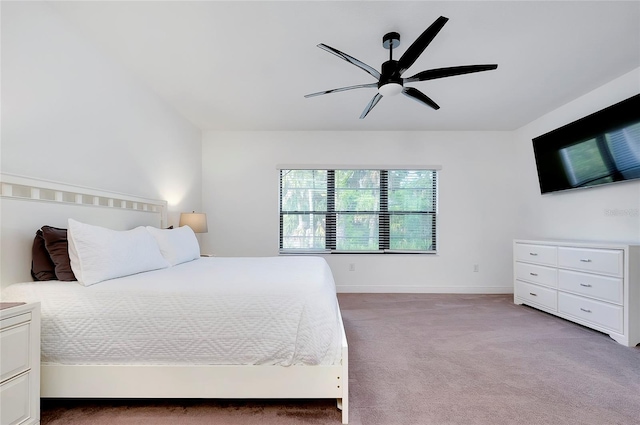 bedroom with baseboards, a ceiling fan, and light colored carpet