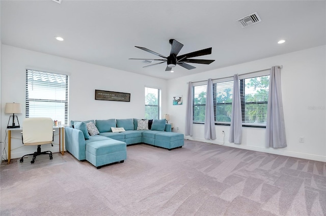 living area with carpet floors, visible vents, a ceiling fan, and recessed lighting