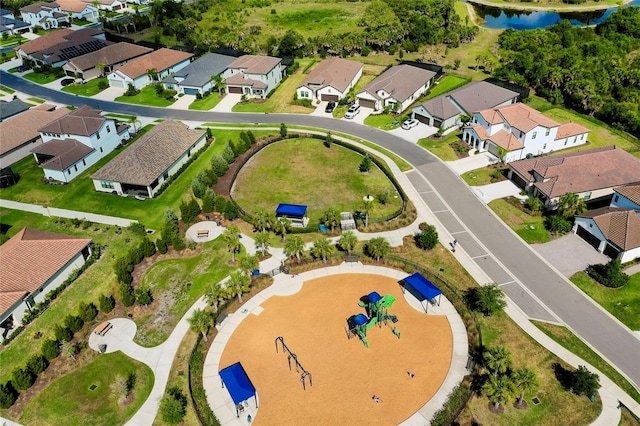 bird's eye view with a water view and a residential view