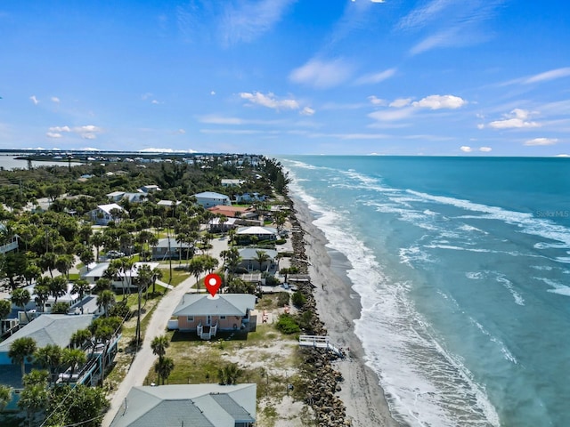 bird's eye view with a beach view, a water view, and a residential view