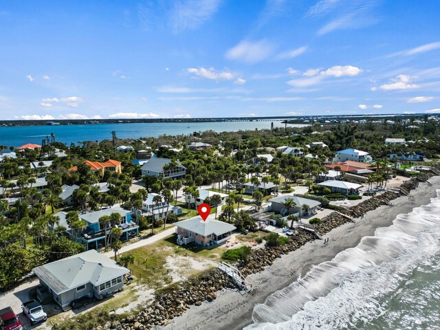 bird's eye view featuring a water view, a residential view, and a view of the beach