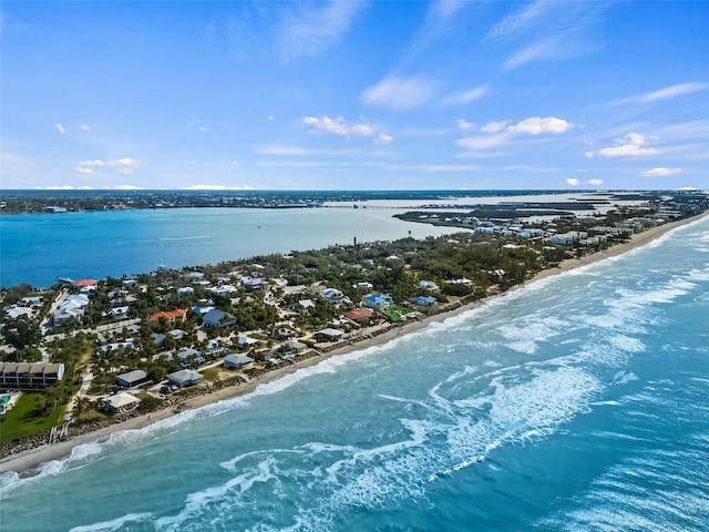 drone / aerial view with a view of the beach and a water view