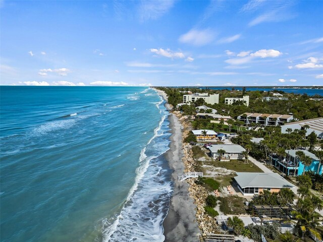 aerial view featuring a view of the beach and a water view