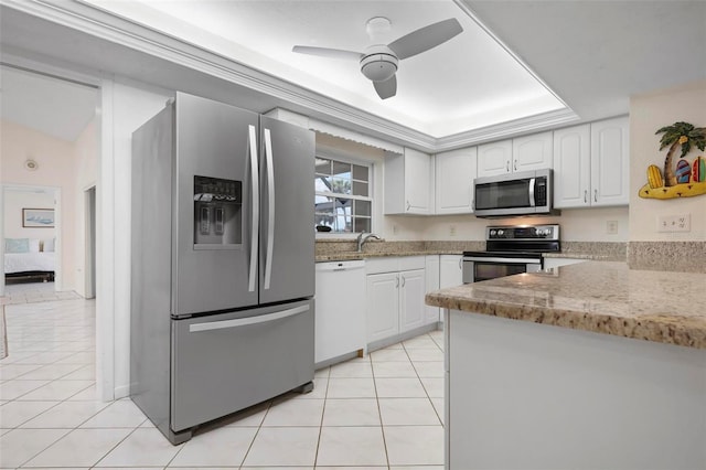 1915 Pebble Beach Ct, Venice, FL 34293 - kitchen with appliances with stainless steel finishes, light tile patterned floors, and white cabinets
