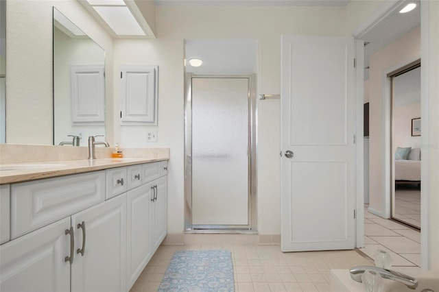 1915 Pebble Beach Ct, Venice, FL 34293 - bathroom featuring vanity, tile patterned floors, ensuite bath, and a stall shower
