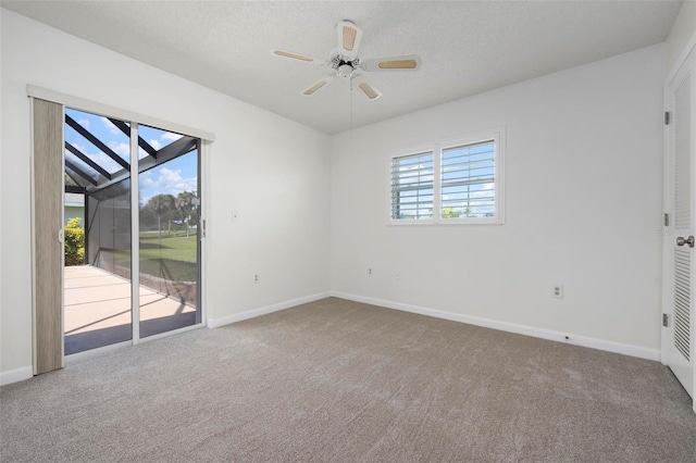 1915 Pebble Beach Ct, Venice, FL 34293 - unfurnished room with carpet, baseboards, and a ceiling fan