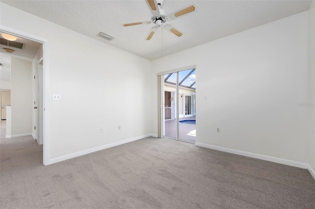 1915 Pebble Beach Ct, Venice, FL 34293 - carpeted empty room with a ceiling fan, baseboards, and a textured ceiling